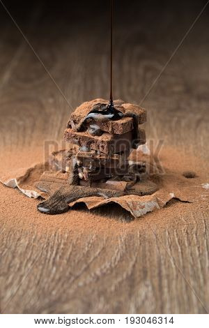 Pyramid of chocolate with syrup