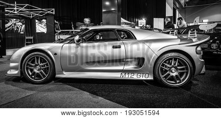 MAASTRICHT NETHERLANDS - JANUARY 15 2016: Sports car Noble M12 GTO 2000. Black and white. International Exhibition InterClassics & Topmobiel 2016