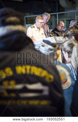 Deputy Command Chaplain Captain Jourden Moger delivers the invocation at the annual Memorial Day Observance ceremony on Intrepid Sea, Air & Space Museum in Manhattan. Fleet Week, NEW YORK MAY 29 2017.