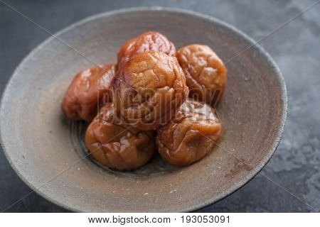 Traditional Japanese Umeboshi as close-up in a bowl