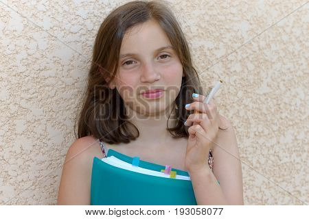 A young teenage girl with a cigarette