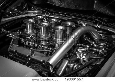 MAASTRICHT NETHERLANDS - JANUARY 15 2016: Engine of a sports car Ferrari Dino 246 GT 1974. Black and white. International Exhibition InterClassics & Topmobiel 2016
