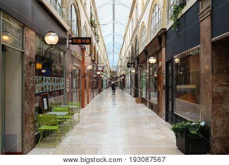 PARIS, FRANCE - June 08, 2017: Interior of Passage Choiseul - shopping area with clothing stores, book stores, jewelers shops and art galleries.