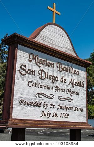 SAN DIEGO, CALIFORNIA - JUNE 24, 2017:  Sign for Mission Basilica San Diego de Alcala, the first Franciscan mission in The Californias, founded on July 16, 1769 by Spanish friar Junipero Serra.