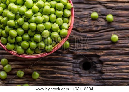 Peas. Fresh bio homemade peas and pods on old oak board. Healthy fresh green vegetable - peas and pods.