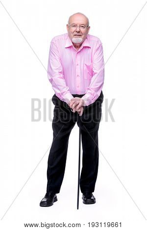 The old man standing with walking stick. Back hurts, radiculitis. Health care for the elderly people.