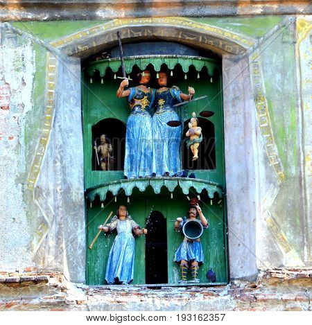 Clock. Urban Landscape In The Downtown Of The Medieval City Sighisoara, Transylvania