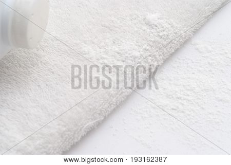 Talcum Powder On A Soft White Towel Background