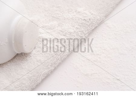 Talcum Powder On A Soft White Towel Background