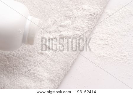 Talcum Powder On A Soft White Towel Background