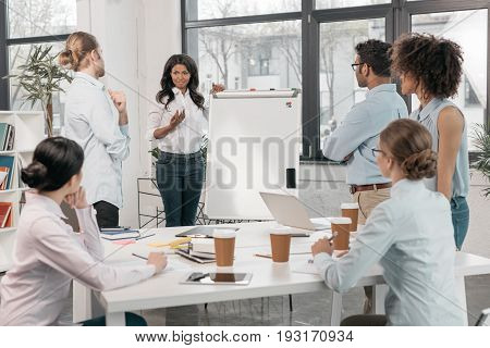 Young Multiethnic Group Of Businesspeople During Workshop At Office