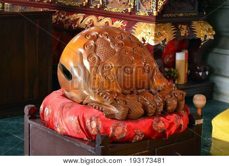 Wooden Fish Wakeful Drum s muyu in Chinese Buddhist temple in Lumbini, Nepal - birthplace of Buddha Siddhartha Gautama.
