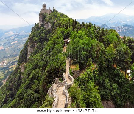 Castle of San Marino on the rock with footpath