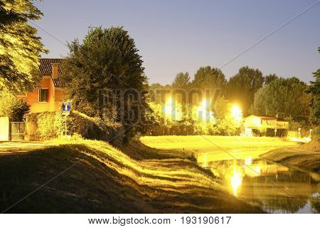 night landscape with the image of channel in Rovigo, Italy