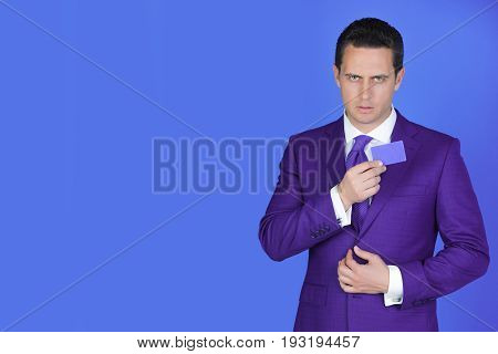 Businessman Holding Business Or Bank Card In Fashionable Suit