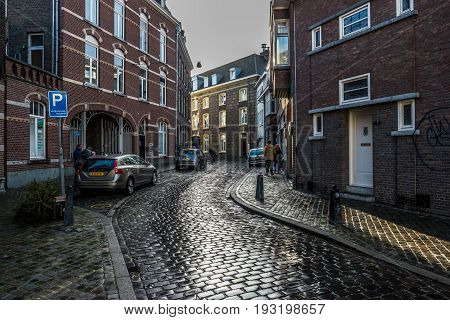 MAASTRICHT NETHERLANDS - JANUARY 16 2016: Old streets in the historic center. Stylization. Toning. Maastricht is the oldest city of the Netherlands and the capital city of the province of Limburg.