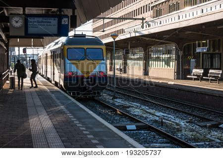 MAASTRICHT NETHERLANDS - JANUARY 17 2016: A passenger train. The main railway station. Railway transport of the Netherlands.
