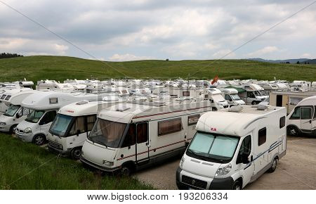 Asiago, Vi, Italy - May 27, 2017: Many Campers Vehicles In The Parking Lot Before The Race Called Gi