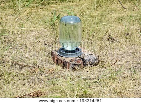Drinking Bowl For Bees. Drinking Bowl From A Three-liter Glass Jar And Plates. Watering For Insects.
