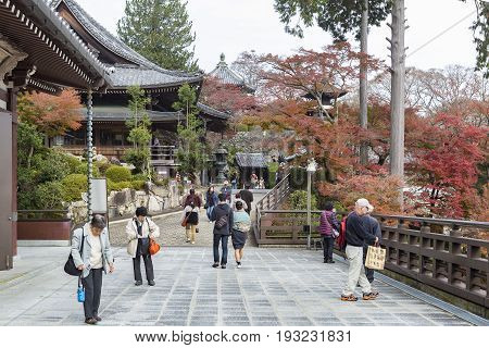 KYOTO JAPAN -NOV 22 2015: Tourists at Yoshimine-dera temple in autumn. Yoshiminedera is a temple of the Tendai sect of Japanese Buddhism located in Kyoto