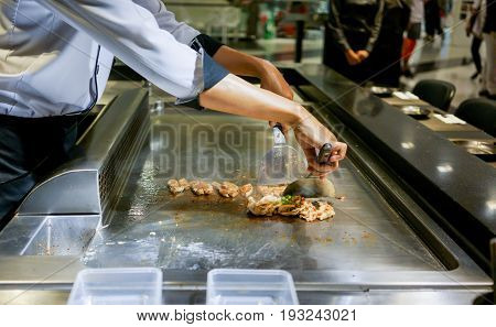Hand Of Chef Cooking Chicken Steak