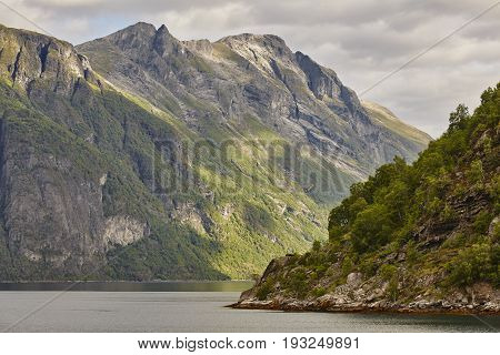 Norwegian fjord landscape. Hellesylt-Geiranger cruise route. Visit Norway. Travel