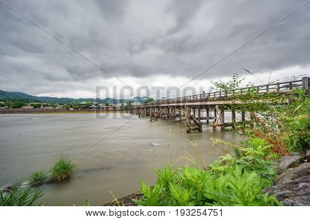 Wide angle long exposure of Katsura River and Togetsukyo Bridge in Arashiyama, Kyoto, Japan.