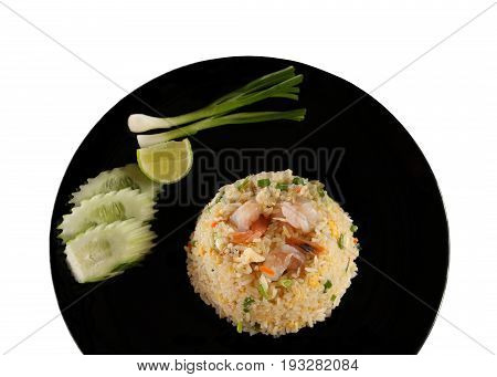 Shrimp fried rice Thai recipe in black dish on white background.