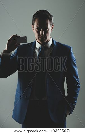 Man Holding Bank Or Business Card