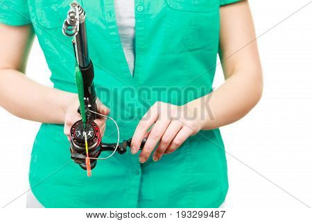Spinning sport equipment concept. Person holding fishing rod with float and waggler with line.