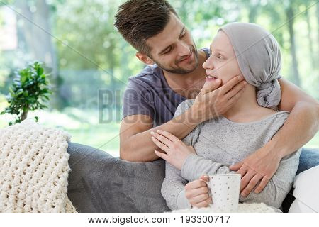 Handsome man supporting his sick wife during chemotherapy