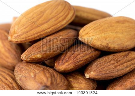 Heap of apricot kernels close up macro