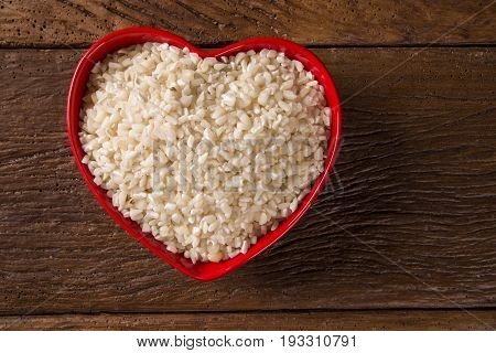 White Grated Corn Kernels In Wooden Bowl. Canjica / Mungunza