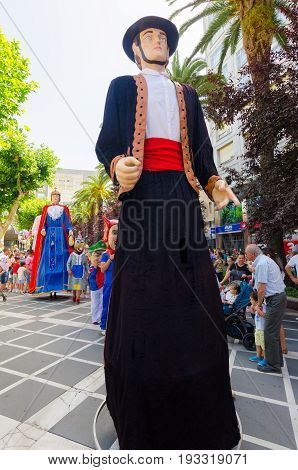 Badajoz, Spain - june 24, 2017: Disguised figures known as giants and big heads,  roughly gigantes y cabezudos parade for the children in the city of Badajoz