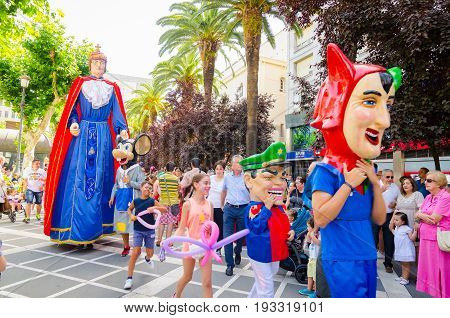 Badajoz, Spain - june 24, 2017: Disguised figures known as giants and big heads,  roughly gigantes y cabezudos parade for the children in the city of Badajoz