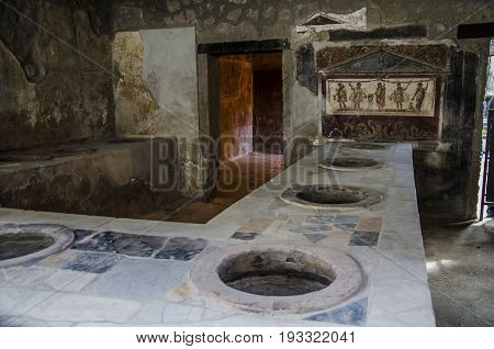 The eruption of Vesuvius allowed to preserve this Roman bar until our days. In it we can see the counter where it was dispatched and the jars for drinks and food.