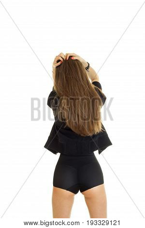 young sexy girl with long hair is worth back to the camera isolated on white background