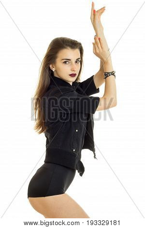 beautiful young girl in a dark suit and with lipstick poses in the Studio isolated on white background