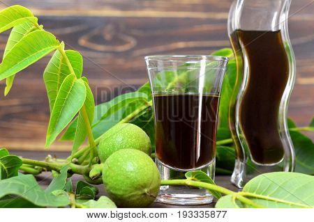 Close up of walnut liqueur in aglass