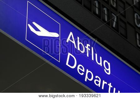 Illuminated sign to the departure at the airport