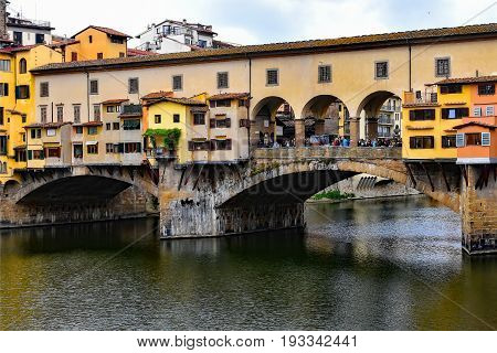 Ponte Vecchio bridge on the river in Florence Italy
