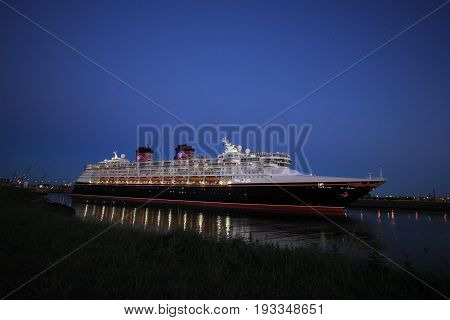IJmuiden the Netherlands - May 25th 2017: Disney Magic leaving North Sea lock IJmuiden.