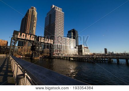 Transfer bridges, support gantries, and piers in the Gantry Plaza State Park and Buildings with blue sky, New York