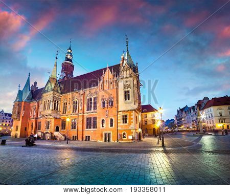 Colorful Evening Scene On Wroclaw Market Square With Town Hall.