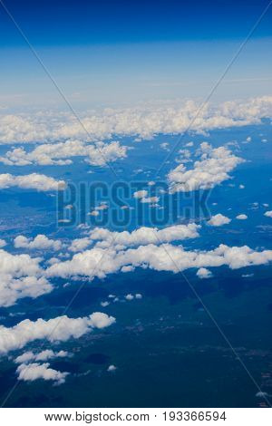 Cumulus cloud and landscape from airplane view