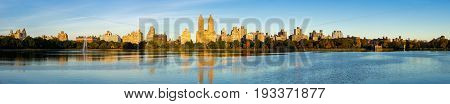 Panoramic morning view of the Upper West Side with the Jacqueline Kennedy Onassis Reservoir and Central Park in Fall. Manhattan New York City
