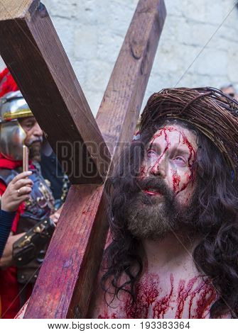 JERUSALEM - APRIL 14 : Christian pilgrim re-enact the crucifixtion of Jesus along the Via Dolorosa in Jerusalem during Good friday on April 14 2017
