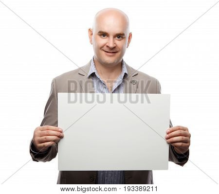 Happy bald man showing and displaying placard ready for your text or product. Isolated on white background with clipping path.