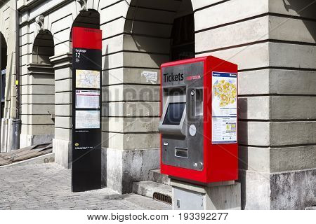 Bern Switzerland - April 17 2017: Self-service tickets machine at Zytglogge trolleybus station. There is a visible post with a timetable