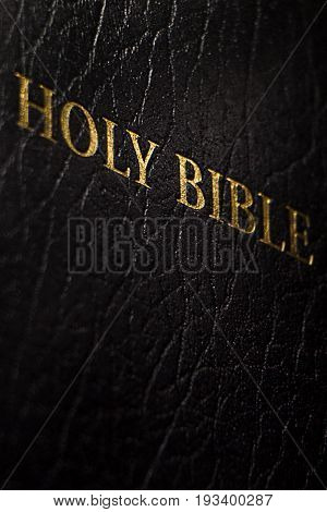 Holy Bible on old wooden church table top view